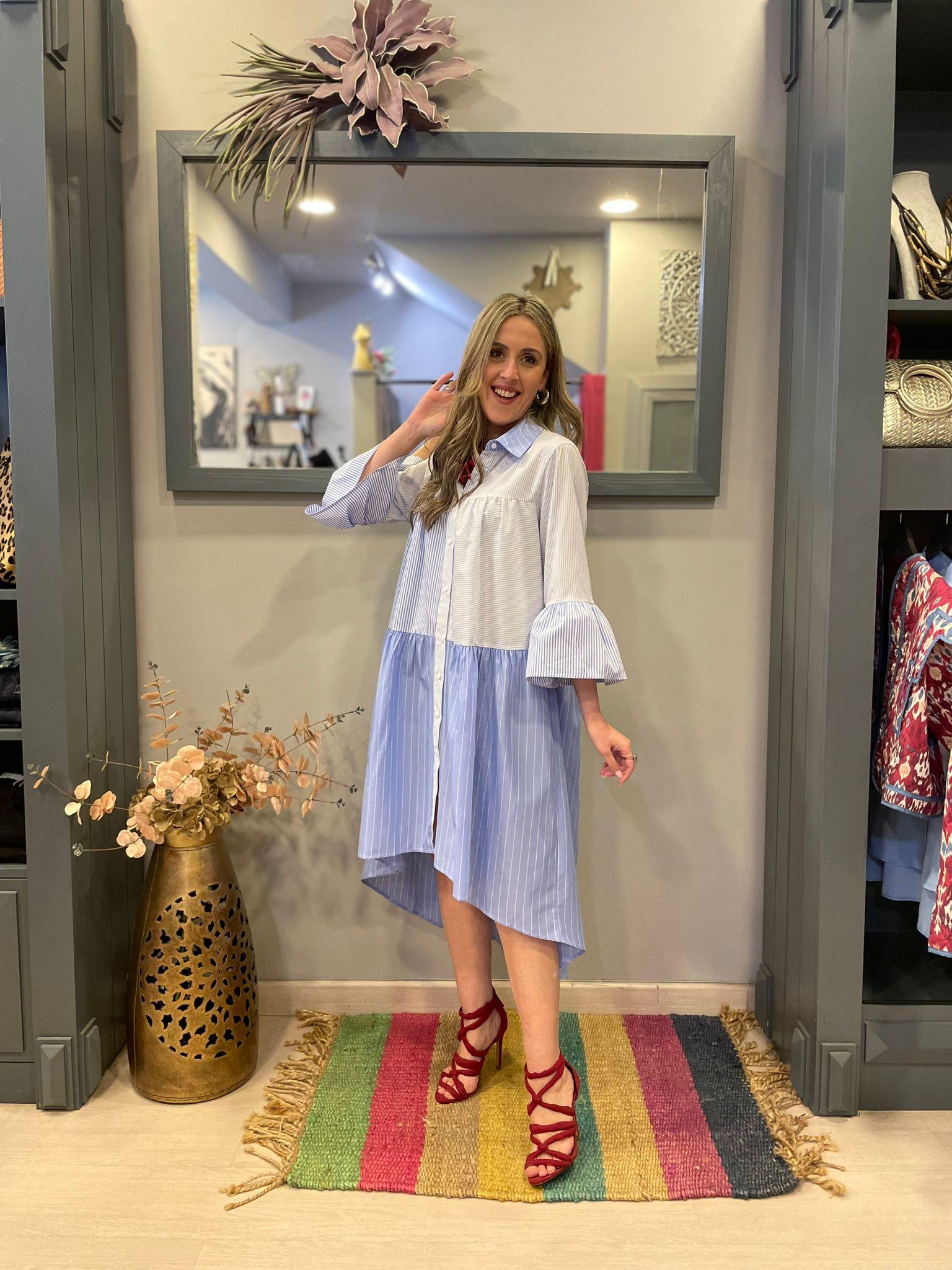 Vestido camisero de rayas corte asimetrico.