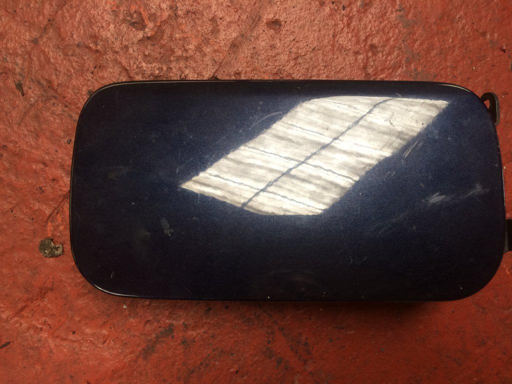 TAPA EXTERIOR COMBUSTIBLE 